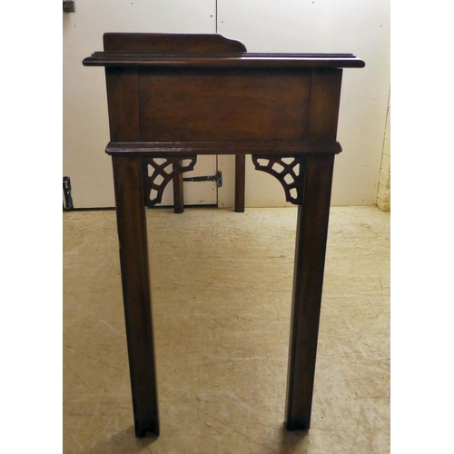 137 - A modern reproduction of a Georgian design, mahogany breakfront, three drawer hall table, raised on ... 