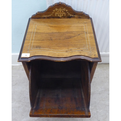 14 - An Edwardian rosewood purdonium with a fall front, on casters  25