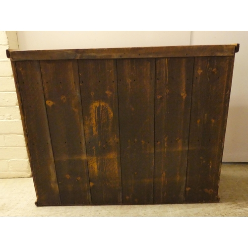 145 - A 20thC pine cabinet with two glazed, sliding doors, on a plinth  27