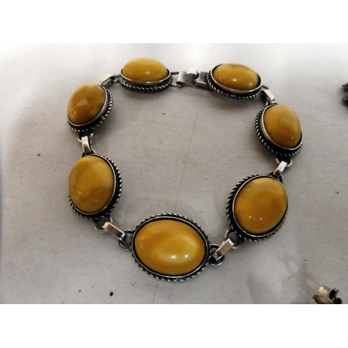 167 - Silver and white metal jewellery, set with amber coloured stones