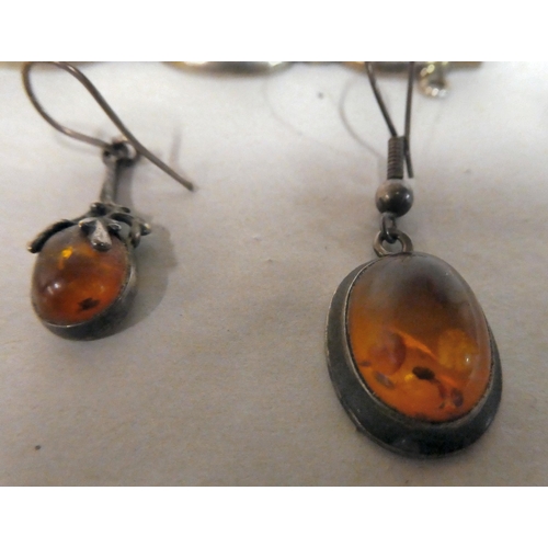 167 - Silver and white metal jewellery, set with amber coloured stones