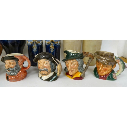 17 - Eleven items of Royal Doulton china and stoneware: to include character jugs; two tone jugs; and vas... 