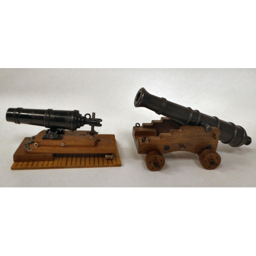 175 - A miniature model cannon with a bronze barrel, on a hardwood carriage  6.5