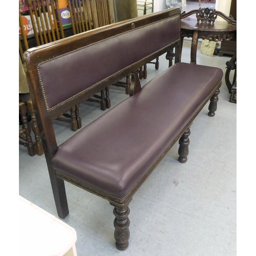 349 - A 20thC mahogany framed and stud upholstered burgundy coloured hide settee, raised on carved foreleg... 