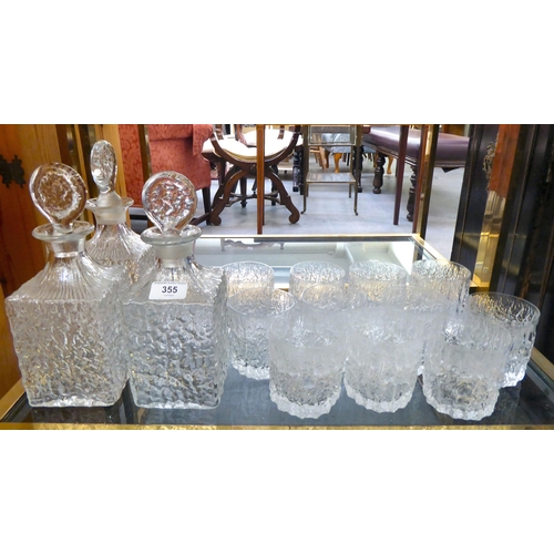 355 - Whitefriars glassware, viz. three bark effect decanters and a set of twelve tumblers