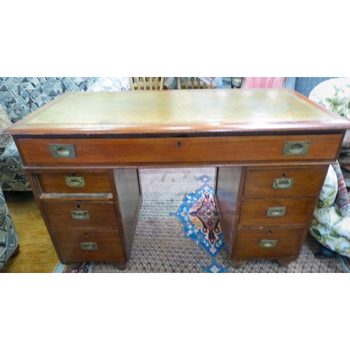 357 - A late Victorian mahogany seven drawer, twin pedestal desk, on a plinth  30