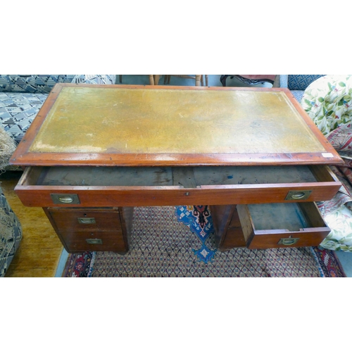 357 - A late Victorian mahogany seven drawer, twin pedestal desk, on a plinth  30