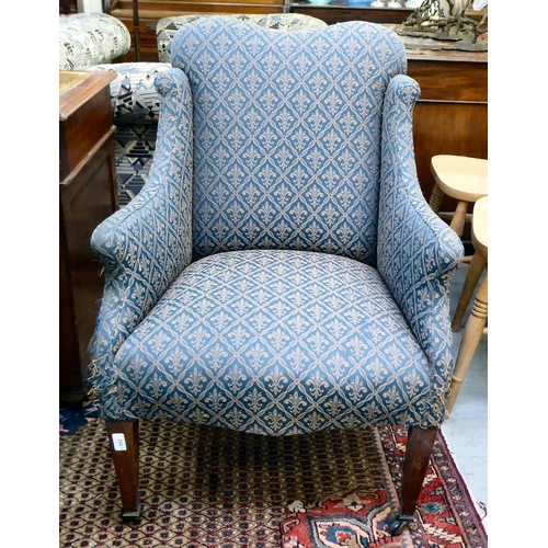 359 - An Edwardian blue fabric upholstered armchair, raised on square mahogany legs 