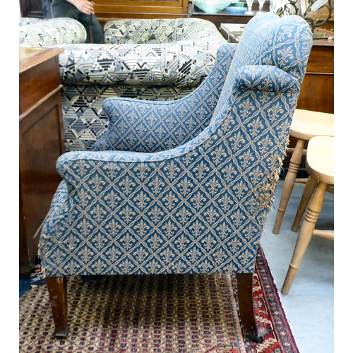 359 - An Edwardian blue fabric upholstered armchair, raised on square mahogany legs 