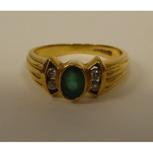 361 - An 18ct gold diamond and emerald ring 