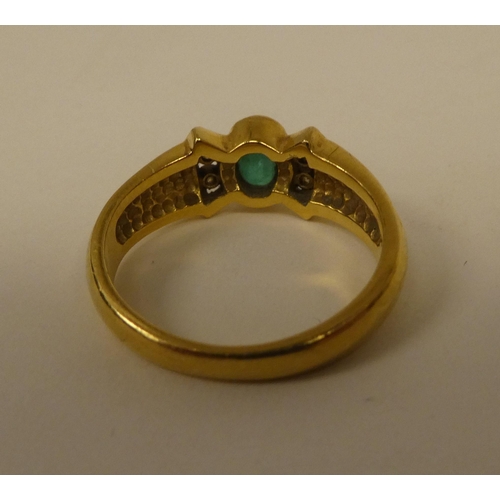 361 - An 18ct gold diamond and emerald ring 