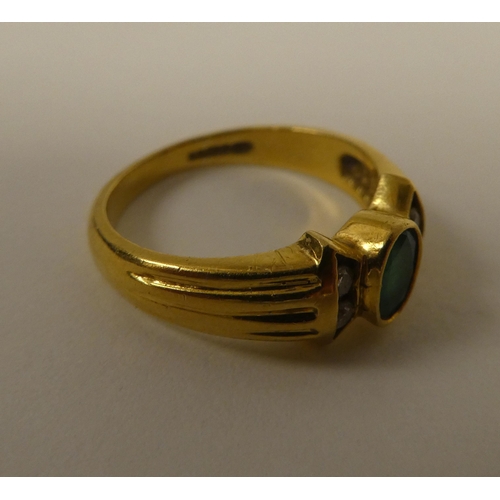 361 - An 18ct gold diamond and emerald ring 