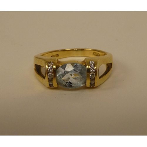 362 - An 18ct gold diamond and aquamarine ring