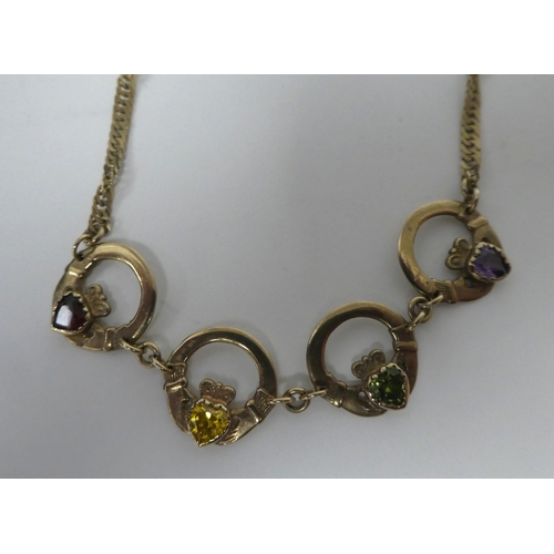 364 - A 9ct gold Claddagh necklace, set with multi-coloured stones 