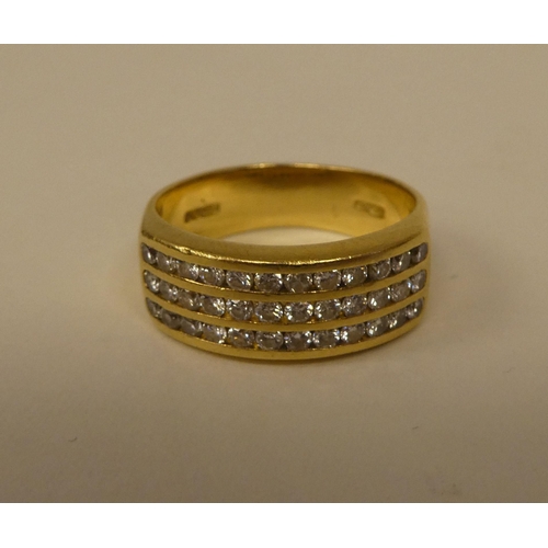 365 - An 18ct gold ring, set with three rows of diamonds 