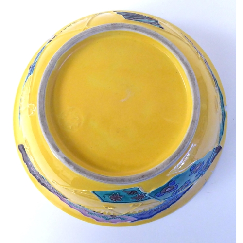 369 - A Japanese Kyoto ware bowl, decorated with fans, on a yellow ground  8