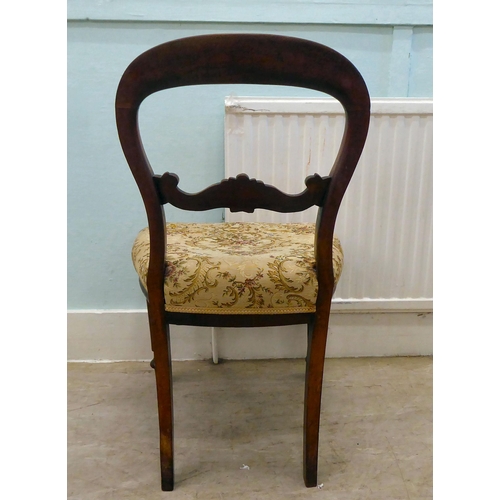 37 - A set of six Victorian mahogany framed balloon back dining chairs with horizontal carved splats and ... 