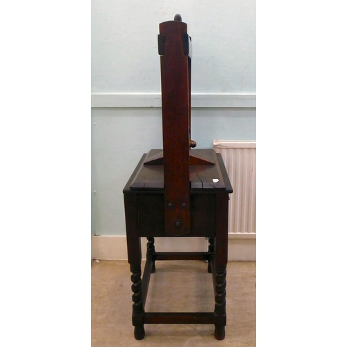 38 - An early 20thC bookpress with a deep drawer and a compatible superstructure, incorporating a central... 