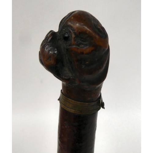 39 - A late 19thC treen page turner with a boxer dog's head carved finial