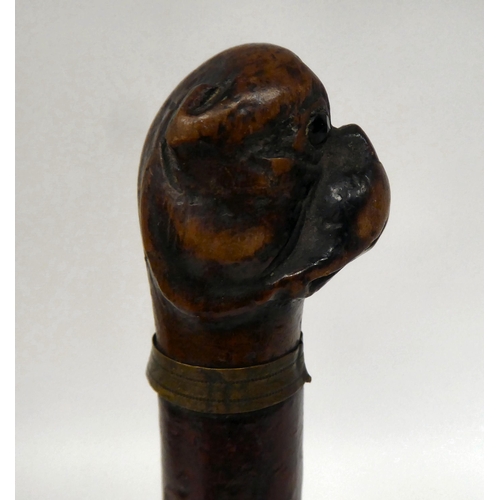 39 - A late 19thC treen page turner with a boxer dog's head carved finial