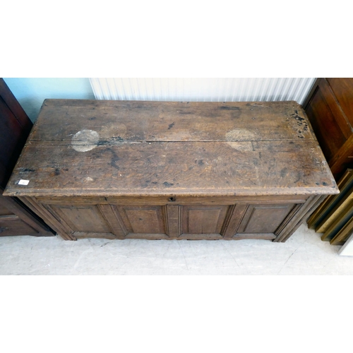 42 - An 18thC country made oak quadruple panelled coffer with straight sides and a hinged lid  24