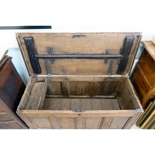 42 - An 18thC country made oak quadruple panelled coffer with straight sides and a hinged lid  24