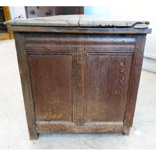 42 - An 18thC country made oak quadruple panelled coffer with straight sides and a hinged lid  24