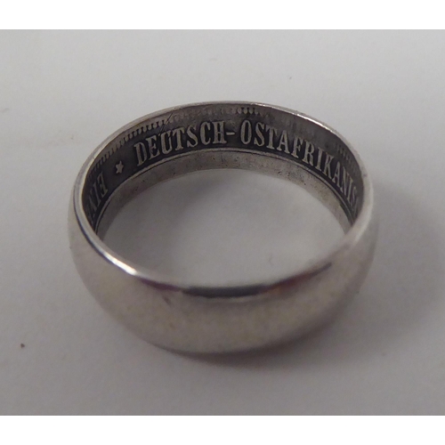 43 - A German East African Society white metal band ring  bears an inscription 