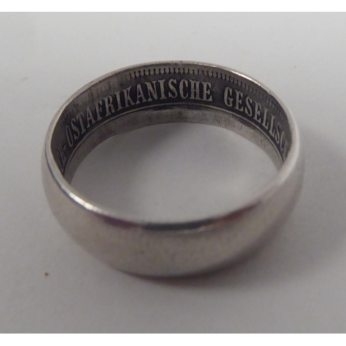 43 - A German East African Society white metal band ring  bears an inscription 