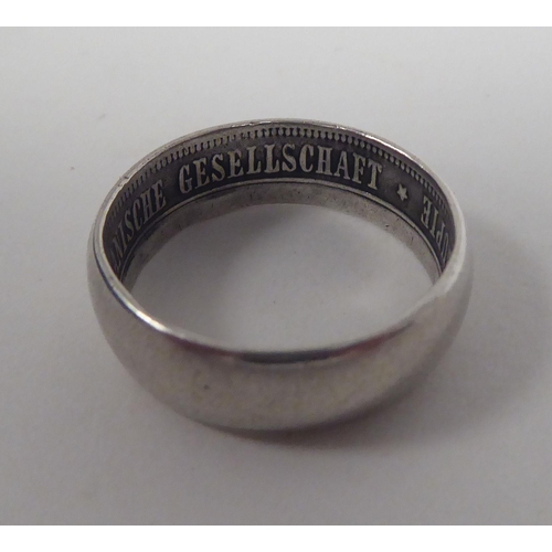 43 - A German East African Society white metal band ring  bears an inscription 