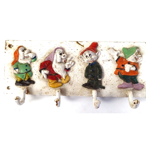 44 - A Walt Disney inspired, painted row of seven coat hooks, featuring Snow White's Dwarf's  5