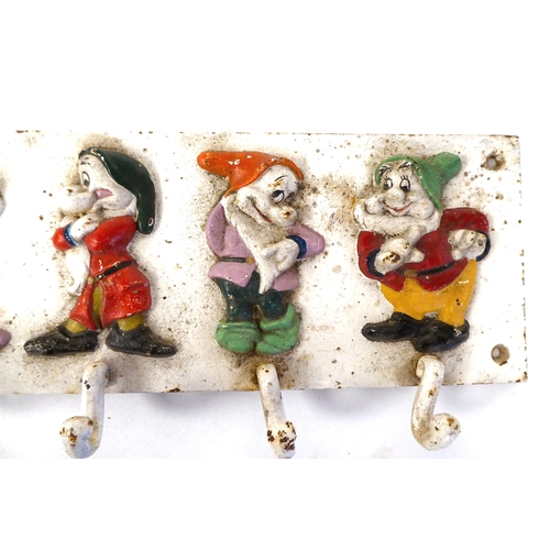 44 - A Walt Disney inspired, painted row of seven coat hooks, featuring Snow White's Dwarf's  5