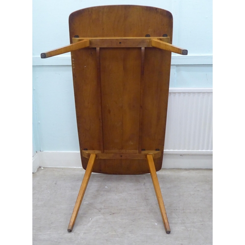 51 - Vintage Ercol beech and elm furniture, comprising four low hoop and spindled back dining chairs; a s... 