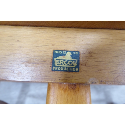 51 - Vintage Ercol beech and elm furniture, comprising four low hoop and spindled back dining chairs; a s... 