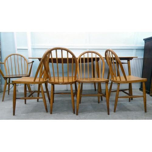 51 - Vintage Ercol beech and elm furniture, comprising four low hoop and spindled back dining chairs; a s... 