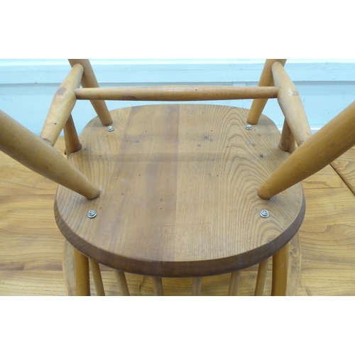 51 - Vintage Ercol beech and elm furniture, comprising four low hoop and spindled back dining chairs; a s... 