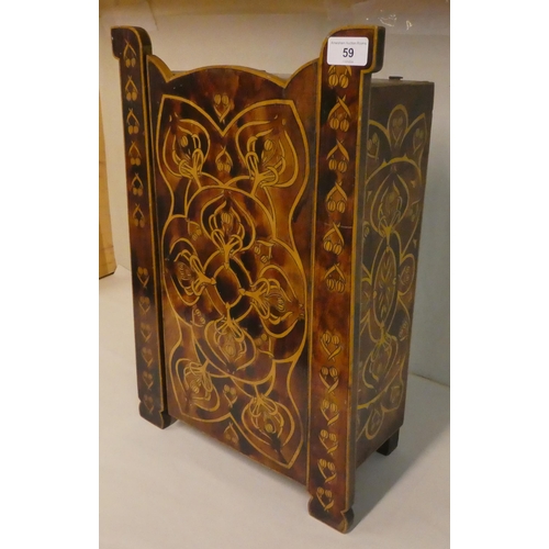 59 - An early 20thC Art Nouveau pokerworked satinwood cabinet with a single door, raised on bracket feet ... 