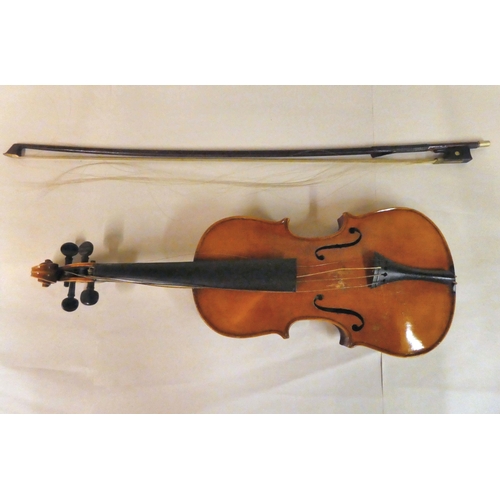 63 - A violin with an inlaid purfled edge and a two-piece back  12.5