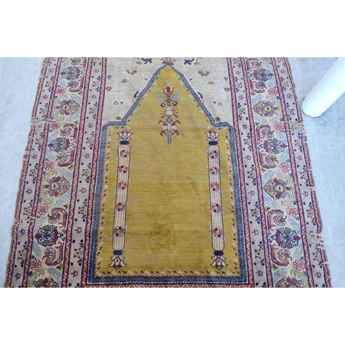 76 - A Turkish prayer mat, on a multi-coloured ground  47