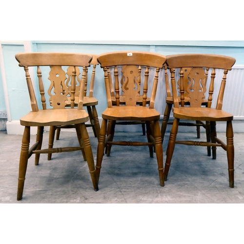 80 - A set of six modern beech framed kitchen chairs with spindled backs and pierced splats, the solid se... 