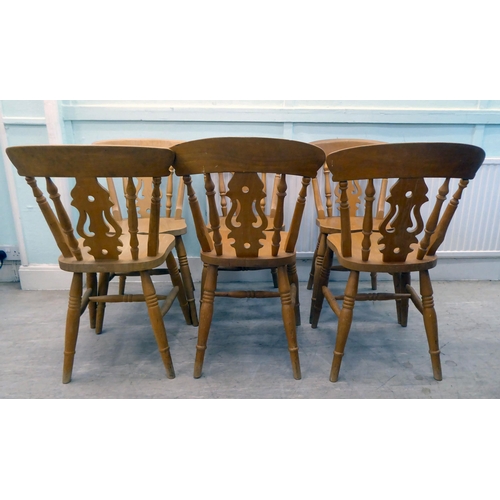 80 - A set of six modern beech framed kitchen chairs with spindled backs and pierced splats, the solid se... 