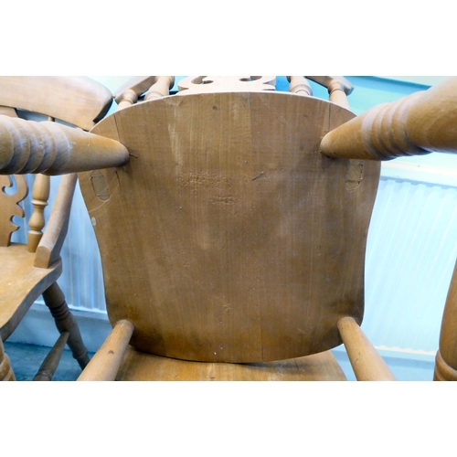 80 - A set of six modern beech framed kitchen chairs with spindled backs and pierced splats, the solid se... 