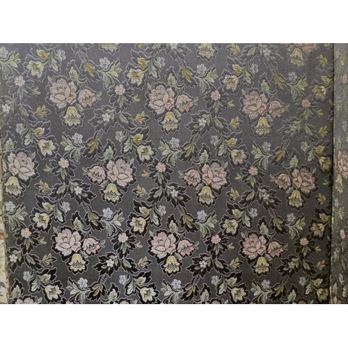 83 - A Edwardian four folding room screen, finished in floral patterned fabric, on a grey ground  77... 