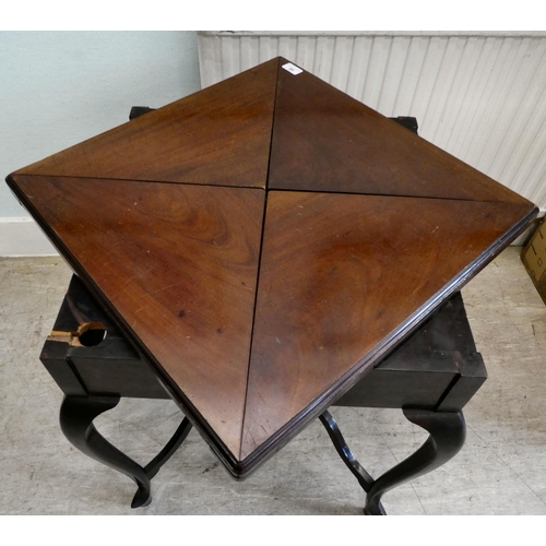 88 - A 1930s mahogany envelope style card table with a rotating top, enclosing a baize lined interior, ov... 