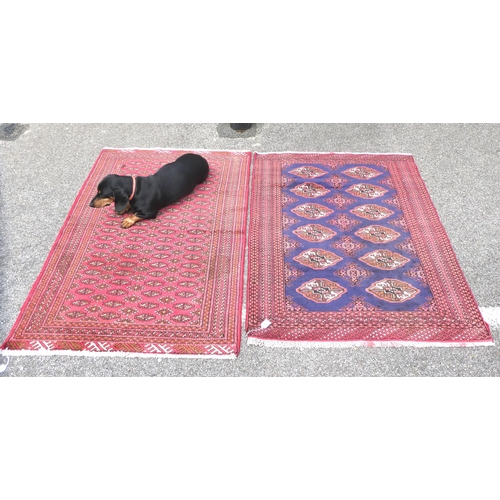 89 - Two dissimilar Turkoman rugs, on red grounds  each 38