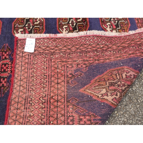 89 - Two dissimilar Turkoman rugs, on red grounds  each 38