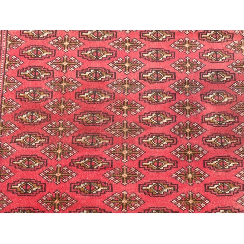 89 - Two dissimilar Turkoman rugs, on red grounds  each 38