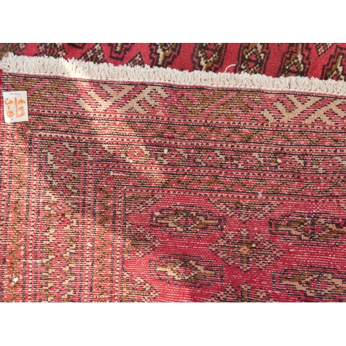 89 - Two dissimilar Turkoman rugs, on red grounds  each 38