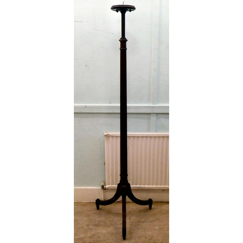 96 - A 1930s mahogany lamp standard with a reed carved column, raised on a played, tripod base  72