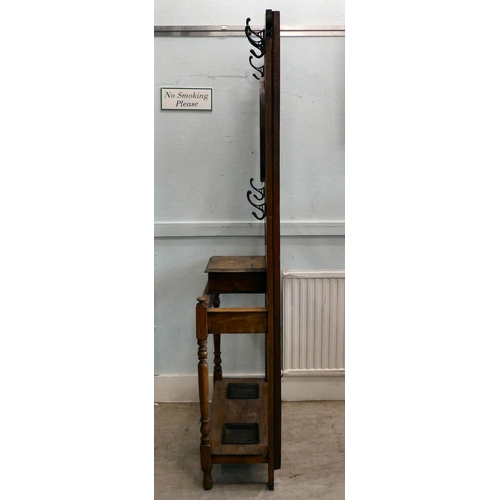 98 - An early 20thC light oak framed hall stand, comprising iron coat hooks, a vanity mirror, glove box a... 